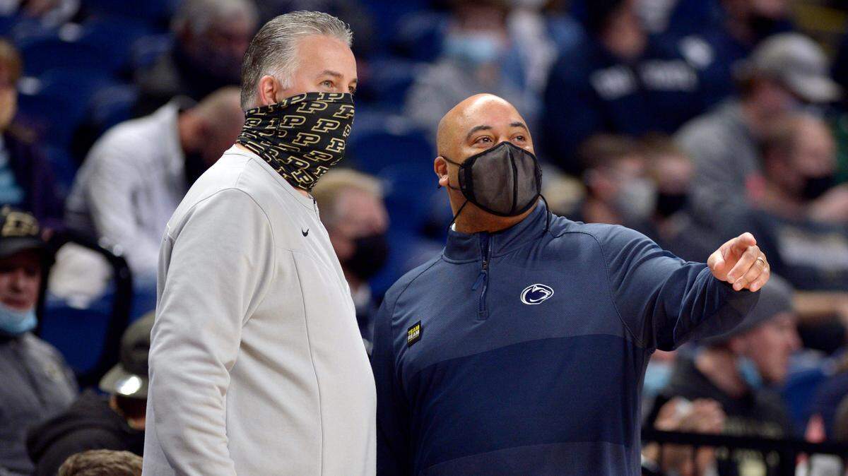 Penn State coach Micah Shrewsberry, right, welcomes Purdue coach Matt Painter to the Bryce Jordan Center before the start of their NCAA college basketball game Saturday, Jan. 8, 2022, in State College.