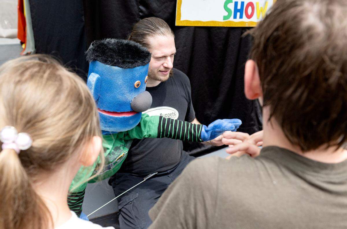 Puppet Jimmy greets fans after a Adam Swartz Puppets show during the Central Pennsylvania Festival of the Arts Children and Youth sidewalk sale on Wednesday, July 9, 2025.