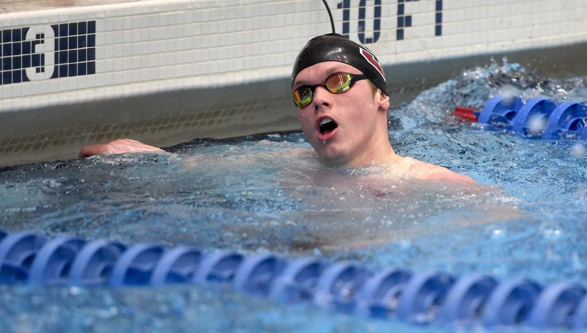 State College’s Matt Brownstead smiles as he looks to the time board after winning the 50 yard freestyle during the District 6 swimming championships on Friday, March 1, 2019 at the Penn State Natatorium.