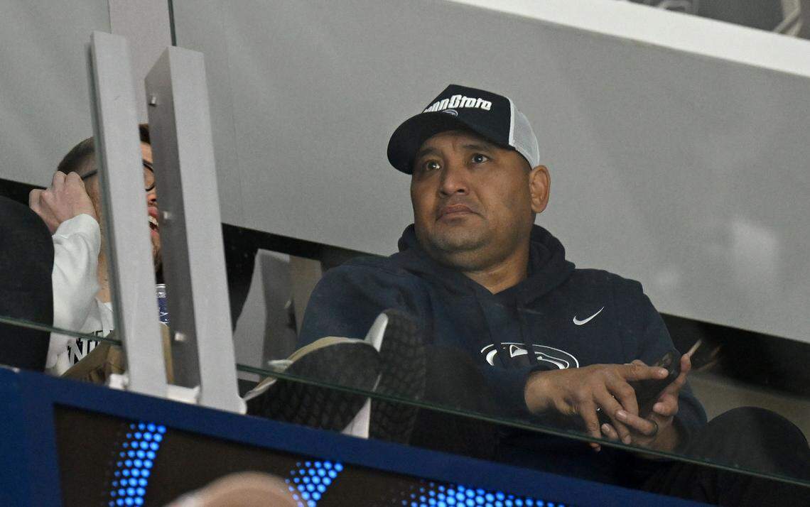 Penn State football’s new defensive line coach Ikaika Malloe watches the men’s hockey game on Friday, Jan. 9, 2026 at Pegula Ice Arena.