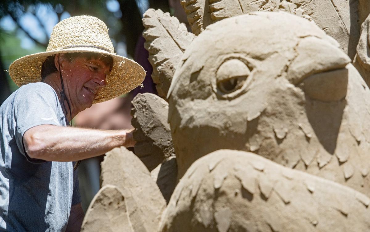 Greg Glenn works on his sand sculpture in Sidney Friedman Park during the Central Pennsylvania Festival of the Arts on July 12, 2018.