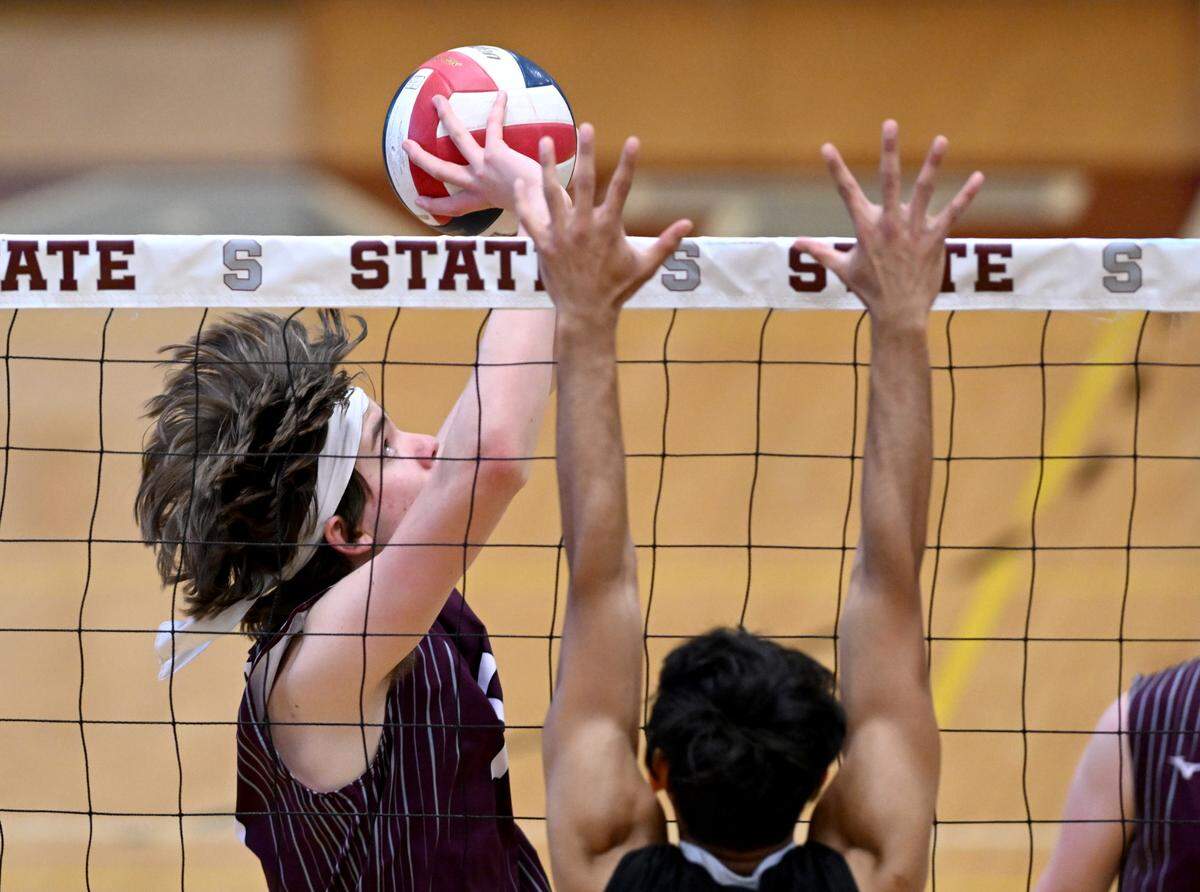 State College’s Derrick Campbell sets the ball for a teammate during the game against Central Dauphin on Wednesday, May 10, 2023.