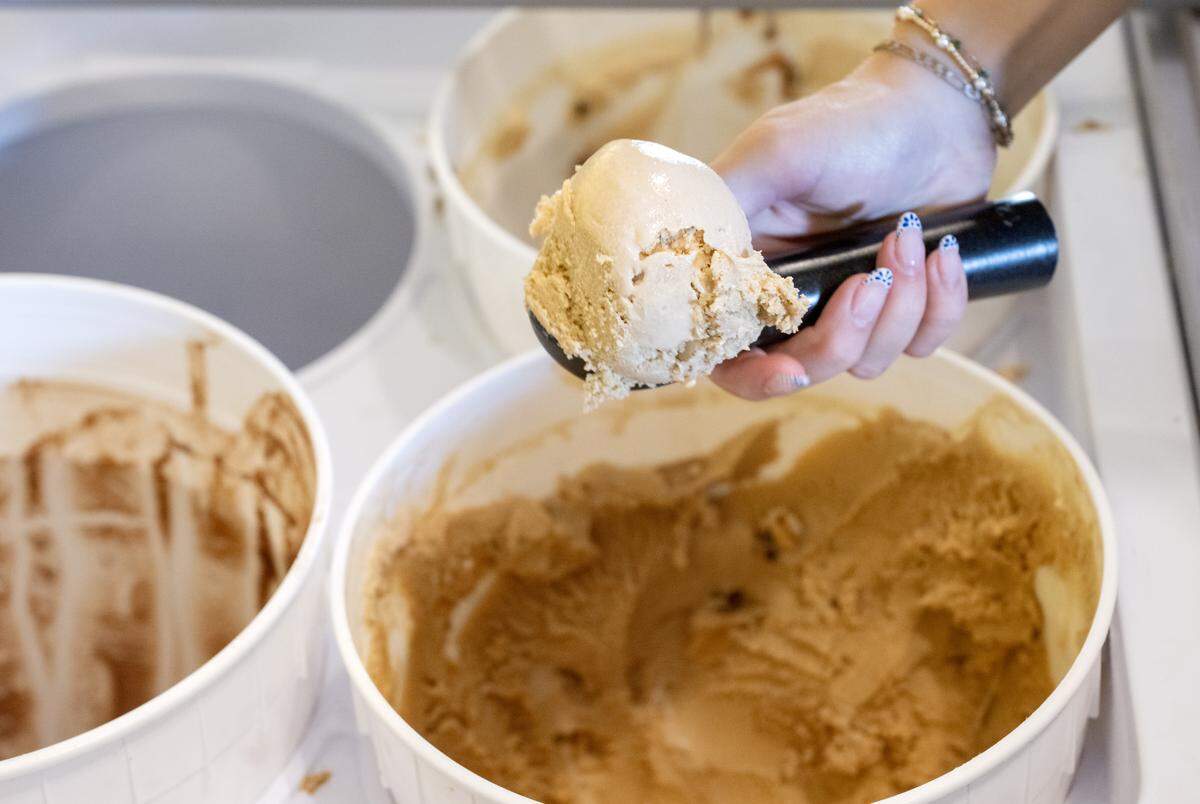A scoop of the white tea brown butter peach ginger ice cream from The Parlor in Bellefonte on Thursday, Aug. 14, 2025. The flavor features white tea vanilla with caramelized brown butter, peaches and fresh ginger.  