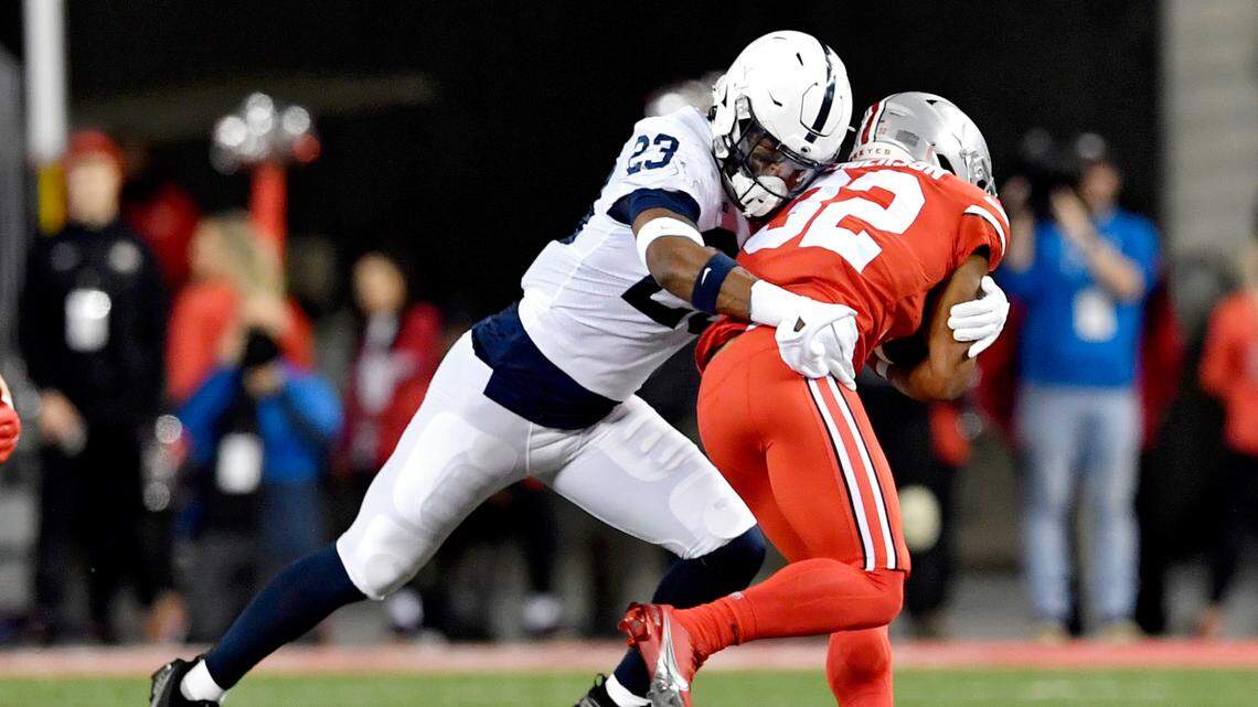 Penn State linebacker Curtis Jacobs stops Ohio State running back TreVeyon Henderson during the game on Saturday, Oct. 30, 2021 at Ohio Stadium.