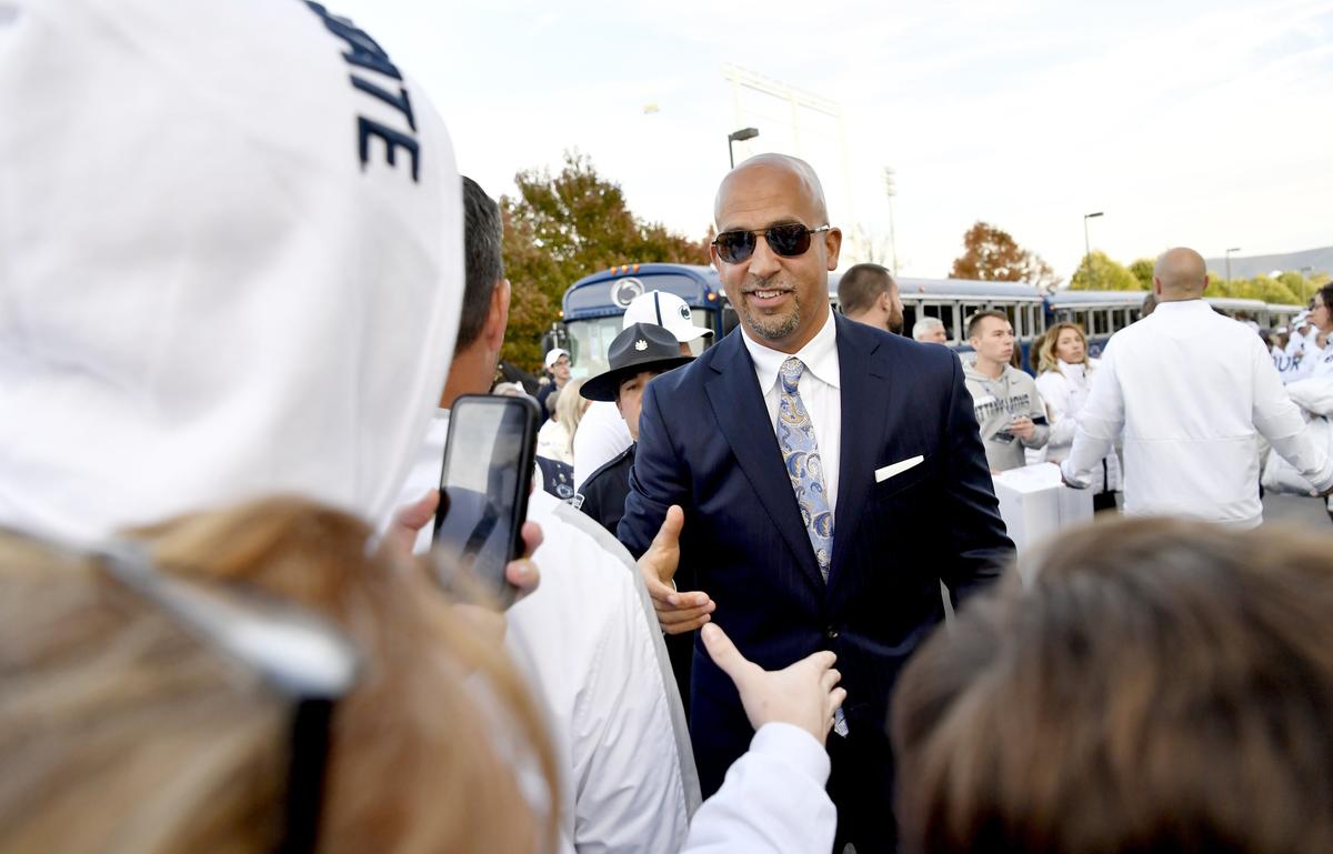 Penn State football coach James Franklin shakes hands with fans as he and the team arrive at Beaver Stadium for the White Out game against Michigan on Saturday, Oct. 19, 2019.