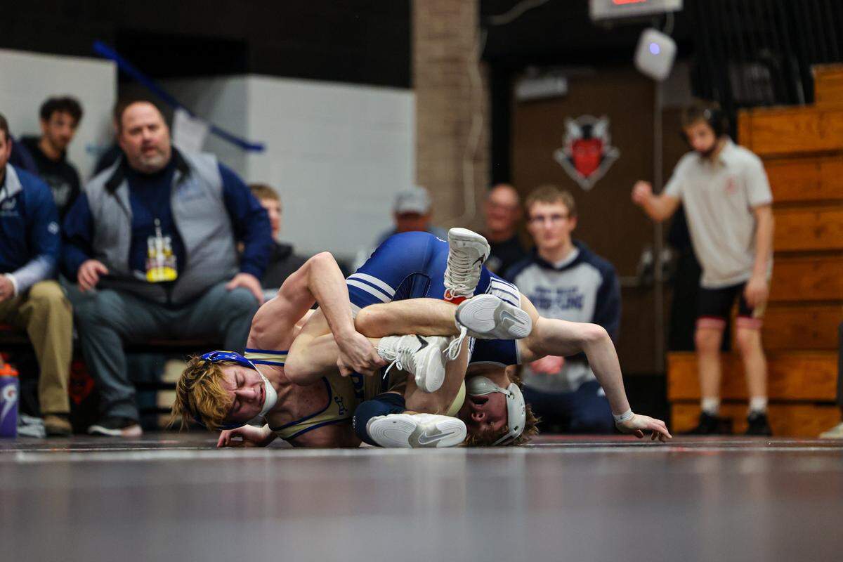 Penns Valley’s Max Dinges, right, scrambles with Chestnut Ridge’s Easton Mull in their 114-pound finals match of the Laurel Highlands Athletic Conference championships on Saturday at Central Cambria High School in Ebensburg. Mull edged Dinges, 7-5.