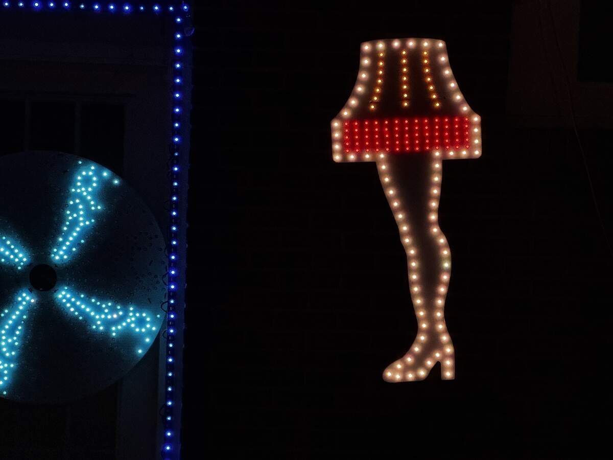 A decoration depicting the leg lamp from “A Christmas Story” hangs on the side of 144 E. Main St., Millheim, on Dec. 6, 2025.
