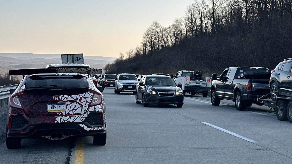 Some vehicles turned around on I-99 N and drove against traffic to get out of a jam after a tractor trailer overturned Friday morning, closing both lanes northbound on the interstate.
