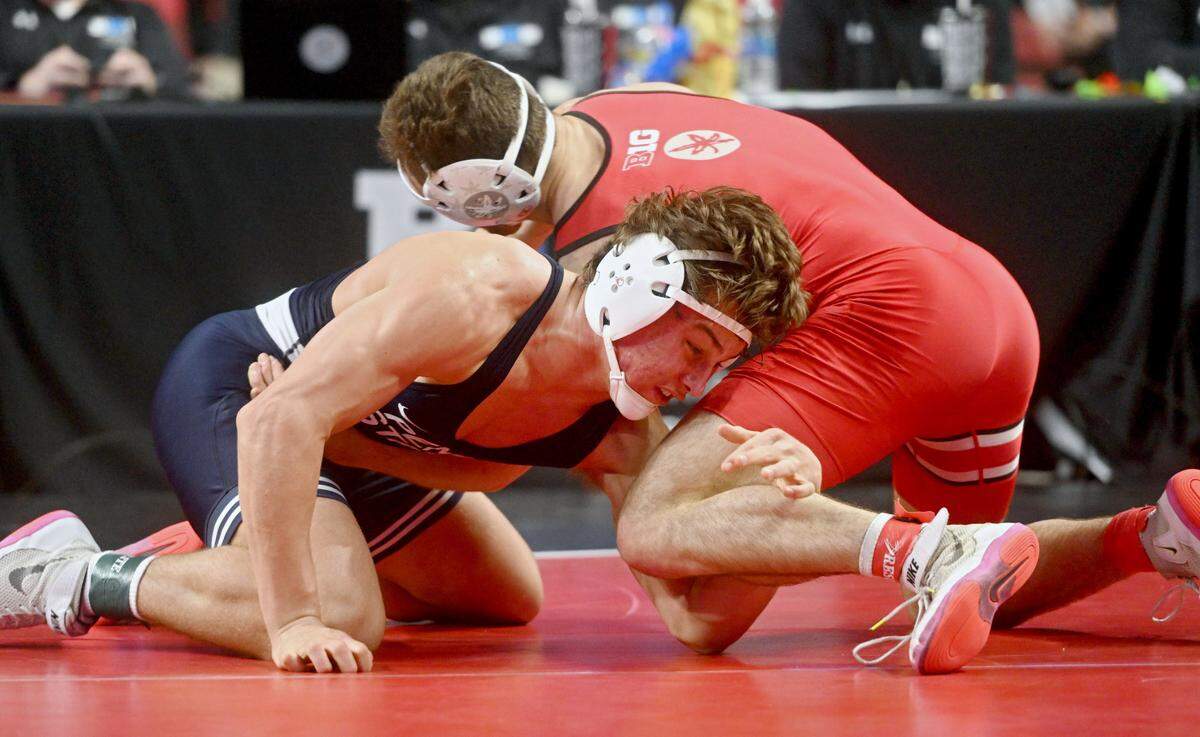 Penn State’s Tyler Kasak reaches for Ohio State’s Dylan D’Emilio in the 149 lb quarterfinal match of the Big Ten Wresting Championships at the Xfinity Center at the University of Maryland on Saturday, March 9, 2024.