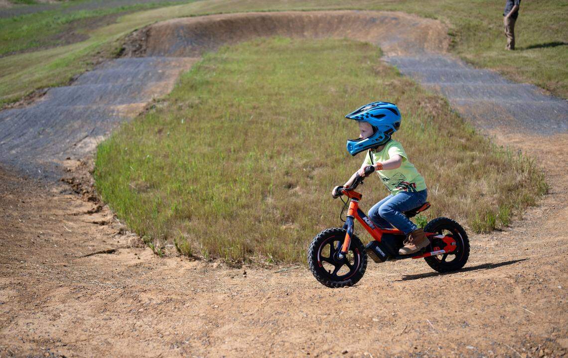 Zane Durkin, 4, rides the new small dirt pump track at Bernel Road Park on Tuesday, May 21, 2024.