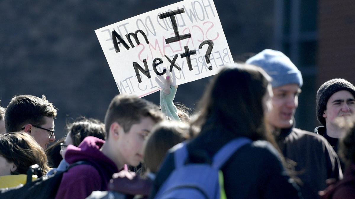 Students at State College Area High School walk out on Friday as part of National School Walkout.