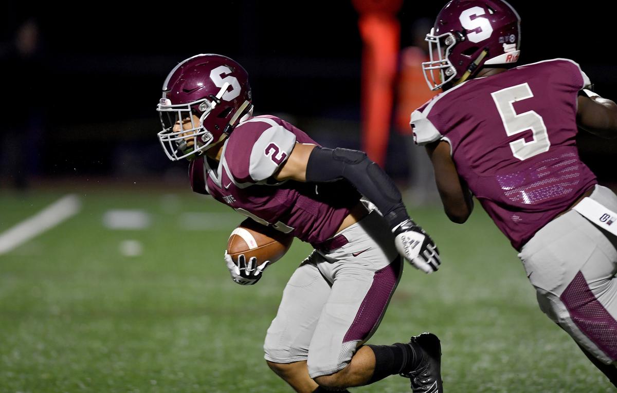 State College’s Dresyn Green intercepts the ball from Harrisburg during the game on Friday, Oct. 4, 2019.