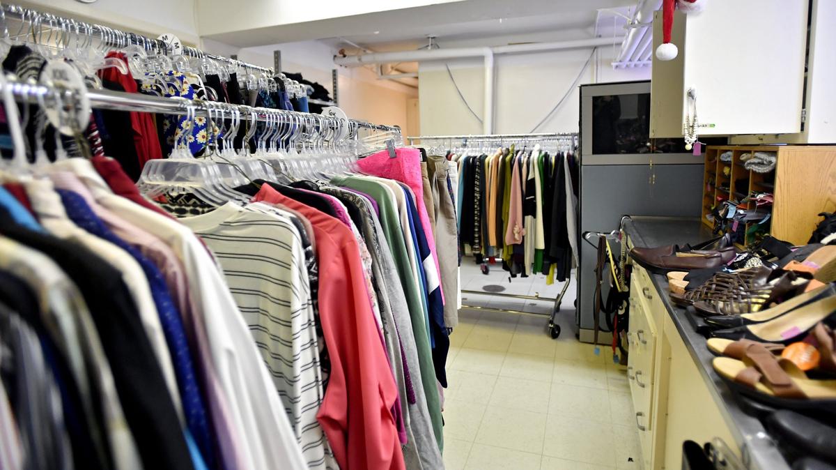 Racks of shirts and pants, in addition to shoes and accessories, at Penn State’s Clothing Transit.
