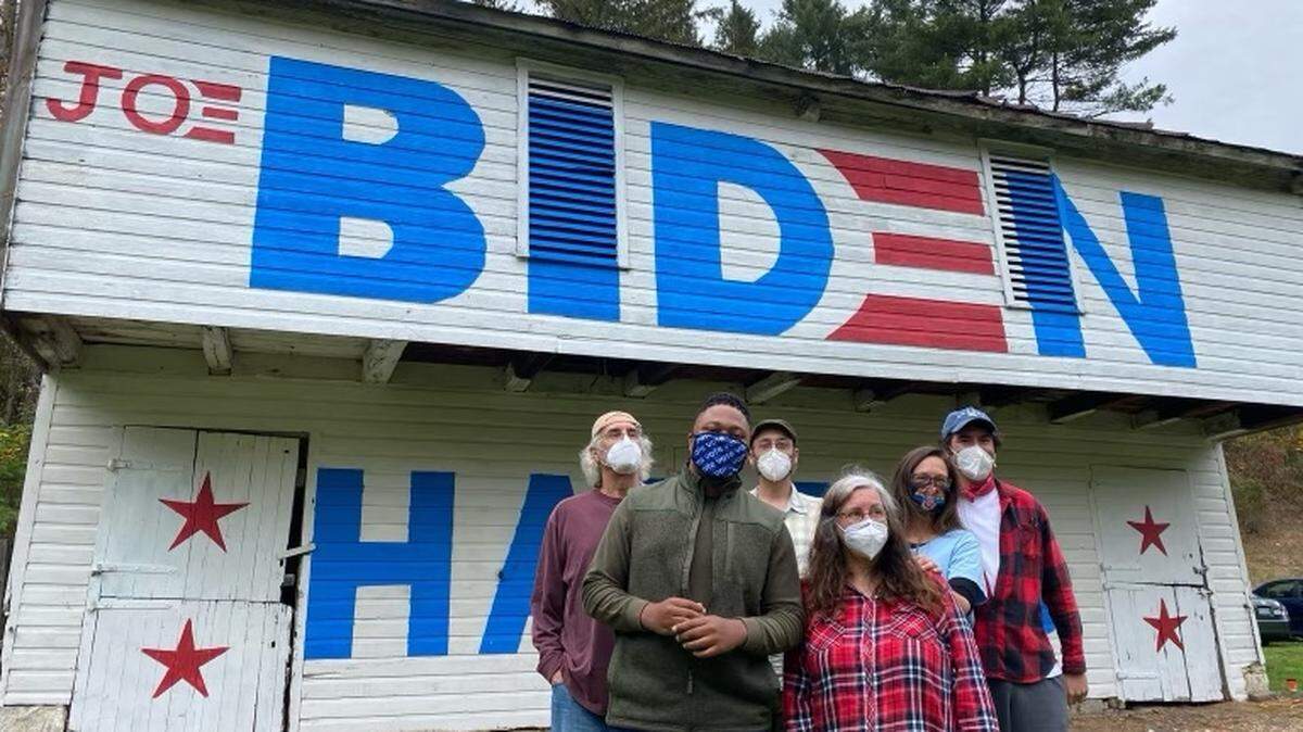 The Herst Family stands with State Rep. Malcolm Kenyatta, D-Philadelphia, in front of the “Biden Barn” in Reedsville, Mifflin County, before the barn burned down Saturday. From left to right: Lawrence Herst, Kenyatta, Nicholas Herst, Robin Herst, Brianna Goss and Troy Goss.