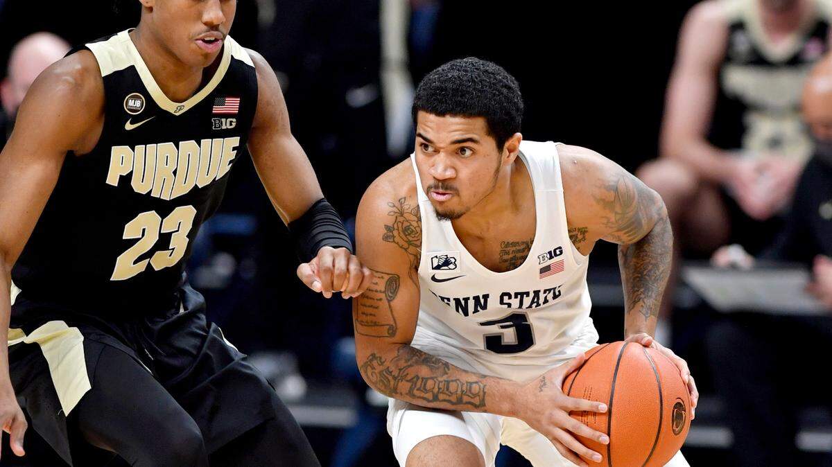 Penn State’s Sam Sessoms dibbles around Purdue’s Jaden Ivey during the game on Friday, Feb. 26, 2021 at the Bryce Jordan Center in State College, Pa.