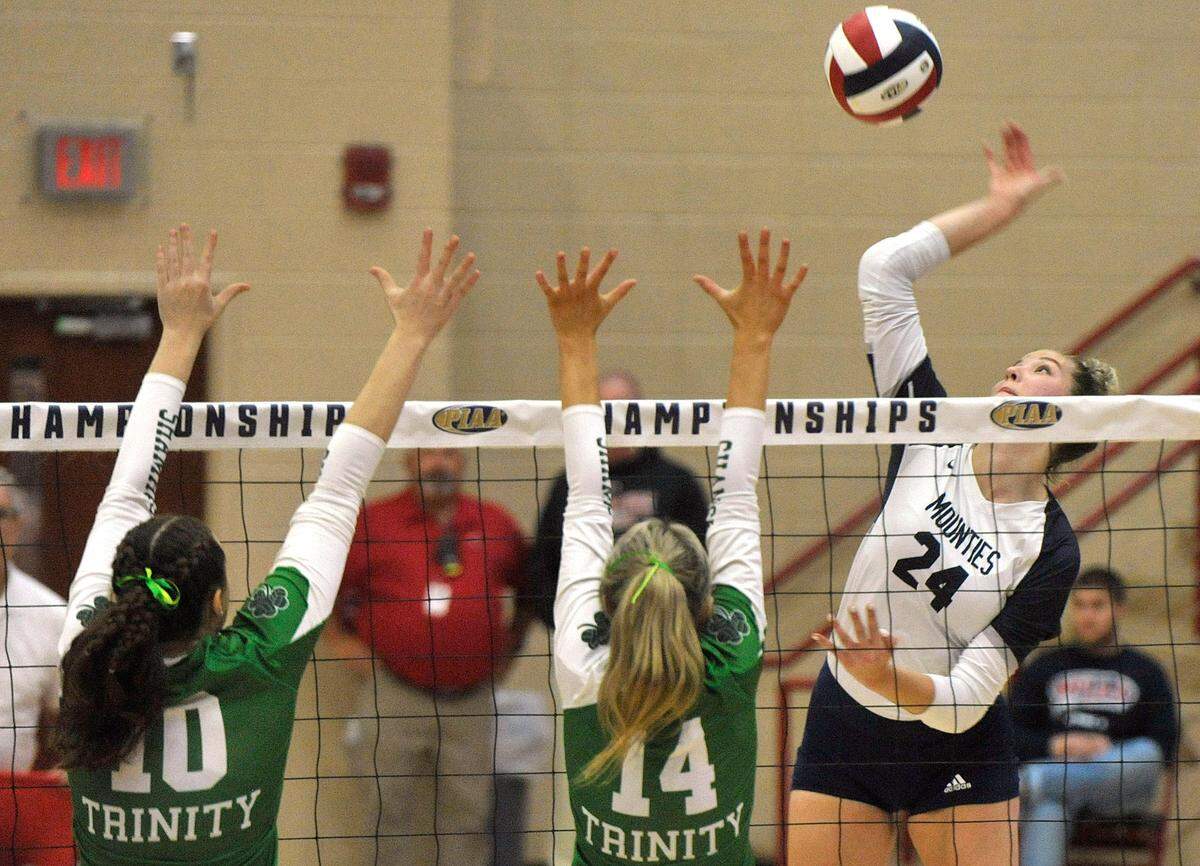 Philipsburg-Osceola’s Reese Hazelton goes up for a kill against Trinity’s Sammie McAuliffe, left, and Adeline Woodward. The Philipsburg-Osceola girls volleyball team won the PIAA Class 2A state championship Saturday at Cumberland Valley in Mechanicsburg. P-O defeated Trinity 3-1.