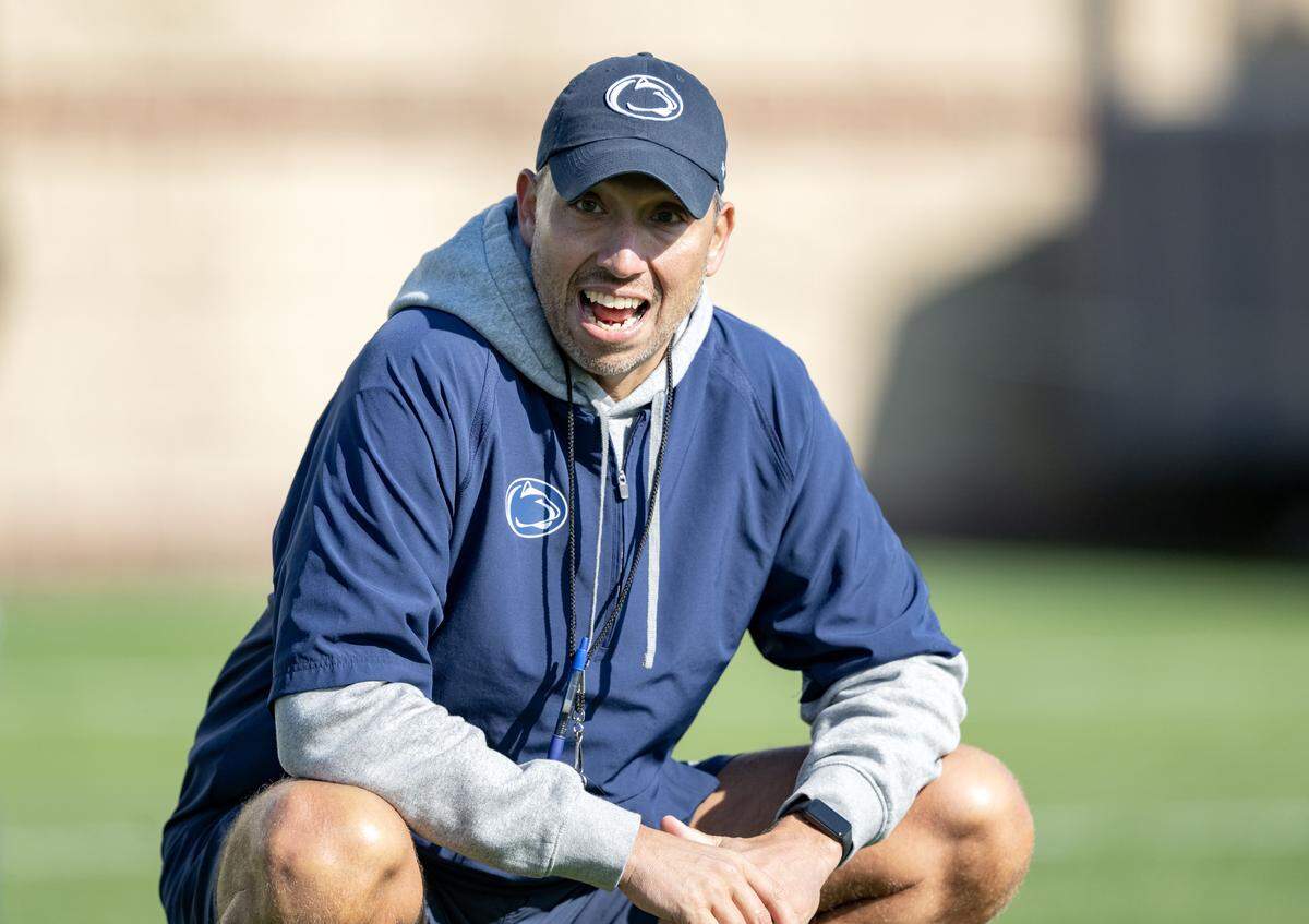 Penn State football coach Matt Campbell yells to defensive players running a drill during practice on Thursday, April 9, 2026.  