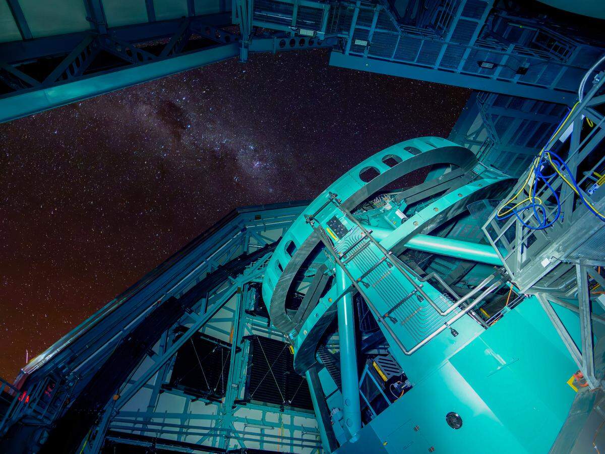 The night sky dazzles through the open dome of the Rubin Observatory. Starting later in 2025, Rubin Observatory’s decade-long Legacy Survey of Space and Time (LSST) will generate an ultra-wide, ultra-high-definition, time-lapse record of the universe.