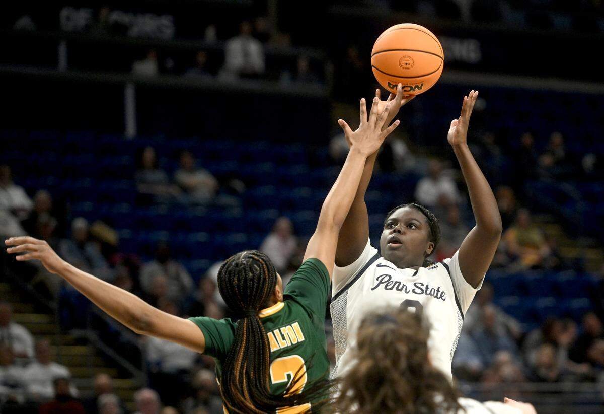 Penn State’s Ashley Owusu makes a shot over George Mason’s Zahirah Walton during the first round game of the Women’s Basketball Invitational Tournament on Thursday, March 21, 2024.