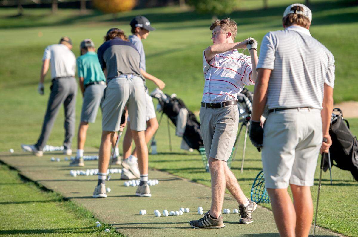 Thomas Hay watches his ball as he and State College golfers practice on Oct. 14 at Centre Hills Country Club.