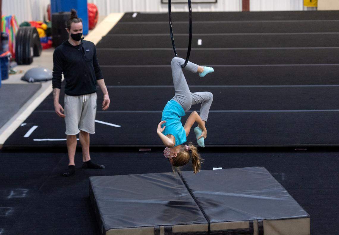 Brielle Long, 12, works on her lyra routine as Dmitry Myers coaches her at the Phoenix Academy of Performing Arts of Pennsylvania on Dec. 7.