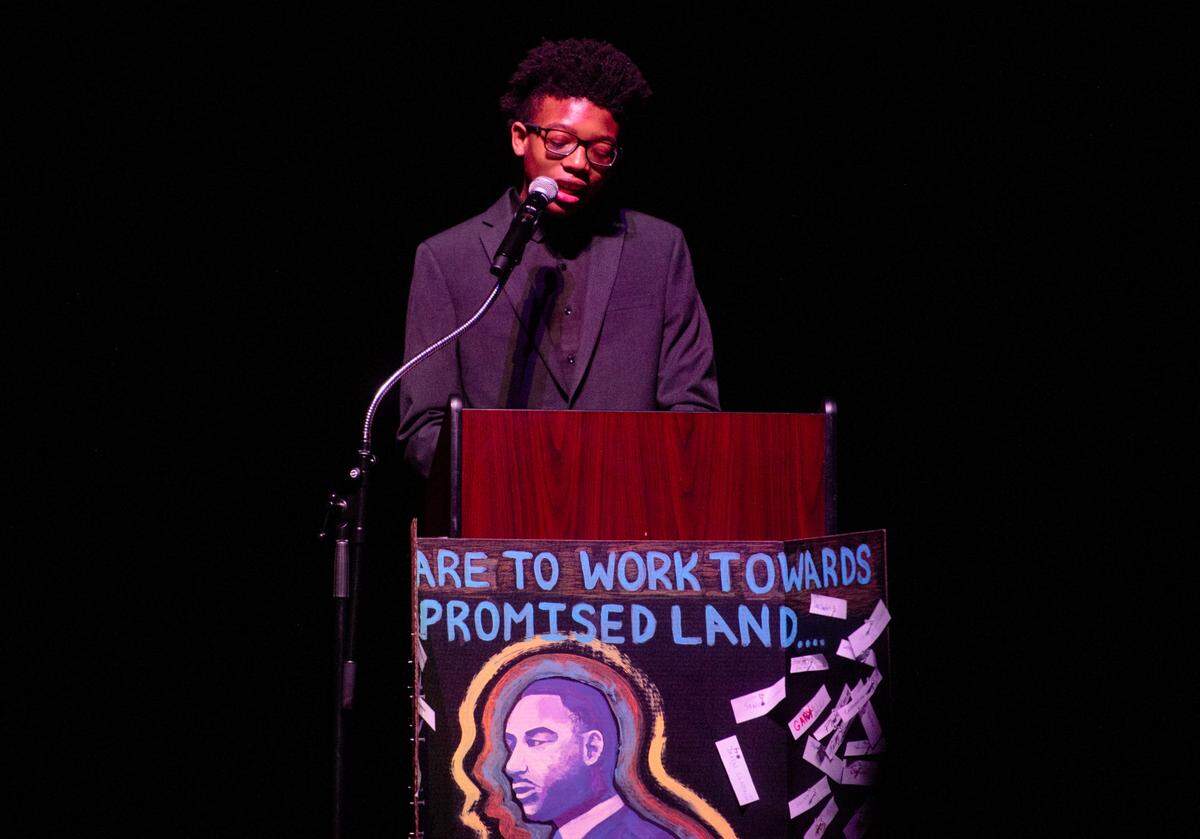 Aneaus Smith reads words from Martin Luther King during the “Lift Every Voice” cultural celebration at State College Area High School on Friday, April 8, 2022.