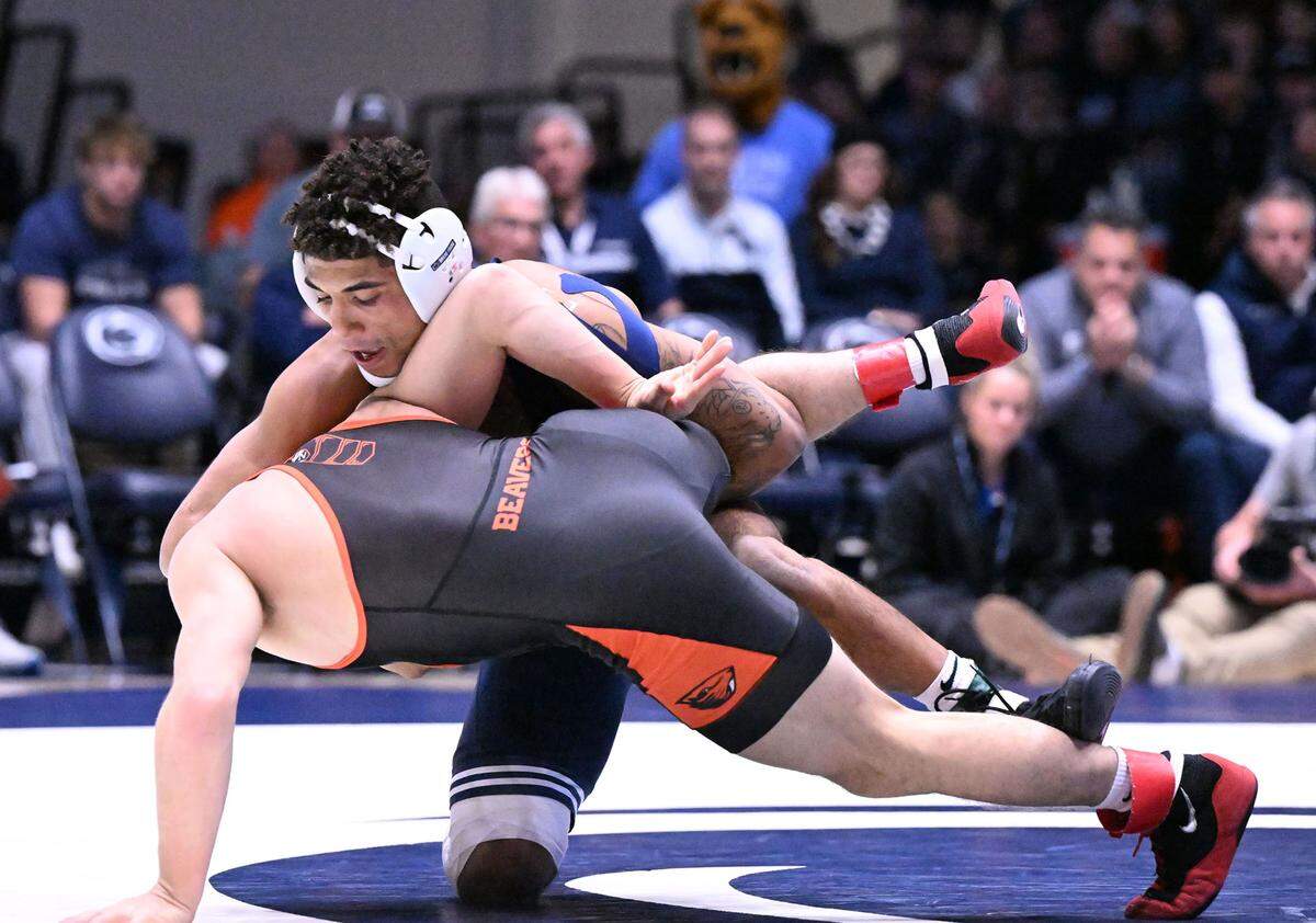 Penn State’s Roman Bravo-Young takes down Oregon State’s Gabe Whisenhunt in the 133-pound bout on Sunday, Dec. 11, 2022 at Rec Hall in State College. Penn State defeated Oregon State, 31-3.