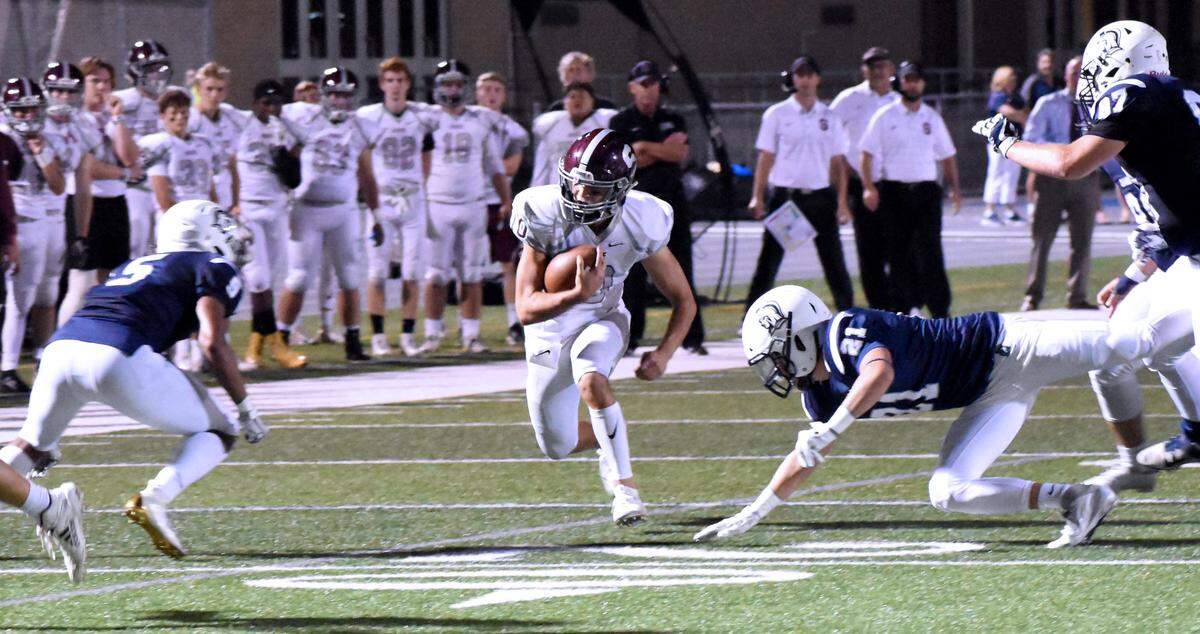 State College quarterback Brady Dorner picks up real estate at Chambersburg.