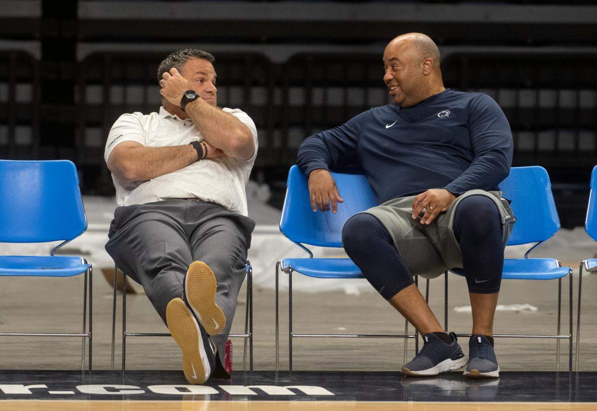 Penn State athletic director Pat Kraft and Penn State men’s basketball coach Micah Shrewsberry talk as the hoops team warms up for a summer practice on Tuesday, July 19, 2022.