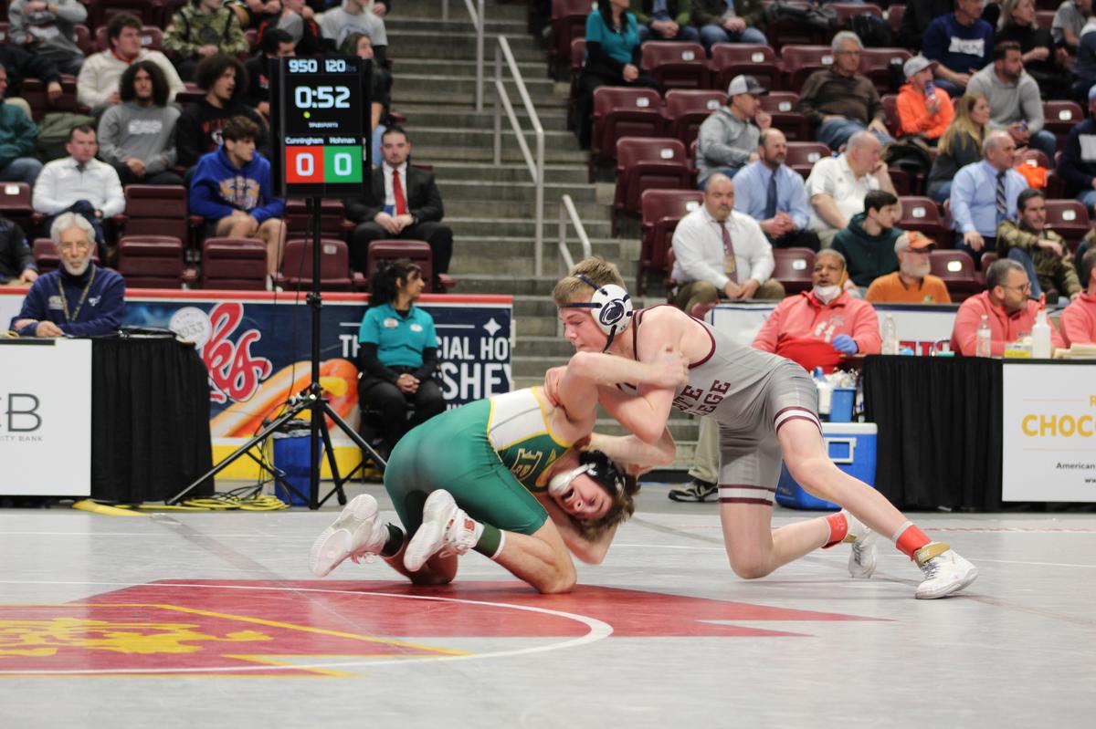 State College’s Asher Cunningham scrambles with Penn Trafford’s Troy Hohman in their 120-pound seventh place match of the PIAA Class 3A Championships on Saturday, March 12, 2022 at Giant Center in Hershey. Hohman picked up a defensive pin on Cunningham in 1:11.