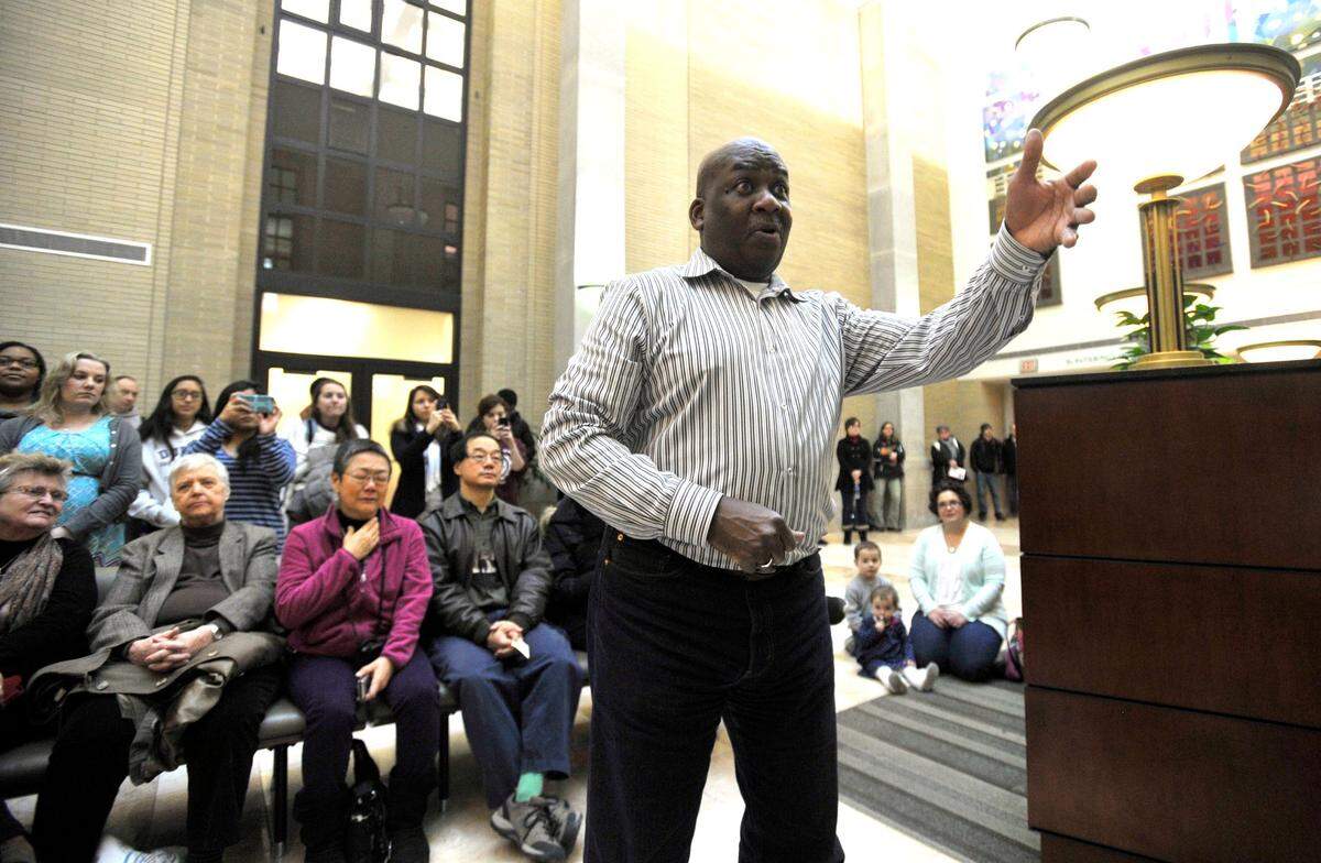 Tony Leach leads the Essence of Joy choir in a MLK Day concert in Pattee Library on January 19, 2015.