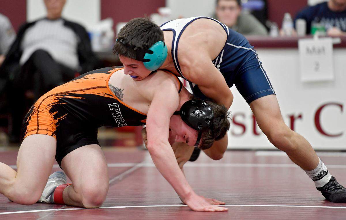 Philipsburg-Osceola’s Marcus Gable controls Tyrone’s Ashton Sipes in the 132 lb championship bout of the District 6 2A tournament on Saturday, Feb. 19, 2022. Gable won by decision 5-3.