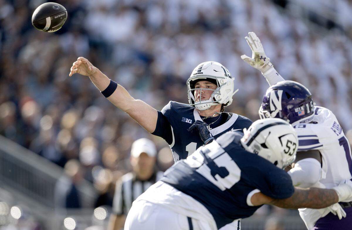 Penn State quarterback Drew Allar makes a pass that was intercepted by Northwestern in the endzone in the first quarter of the game on Saturday, Oct. 11, 2025.  