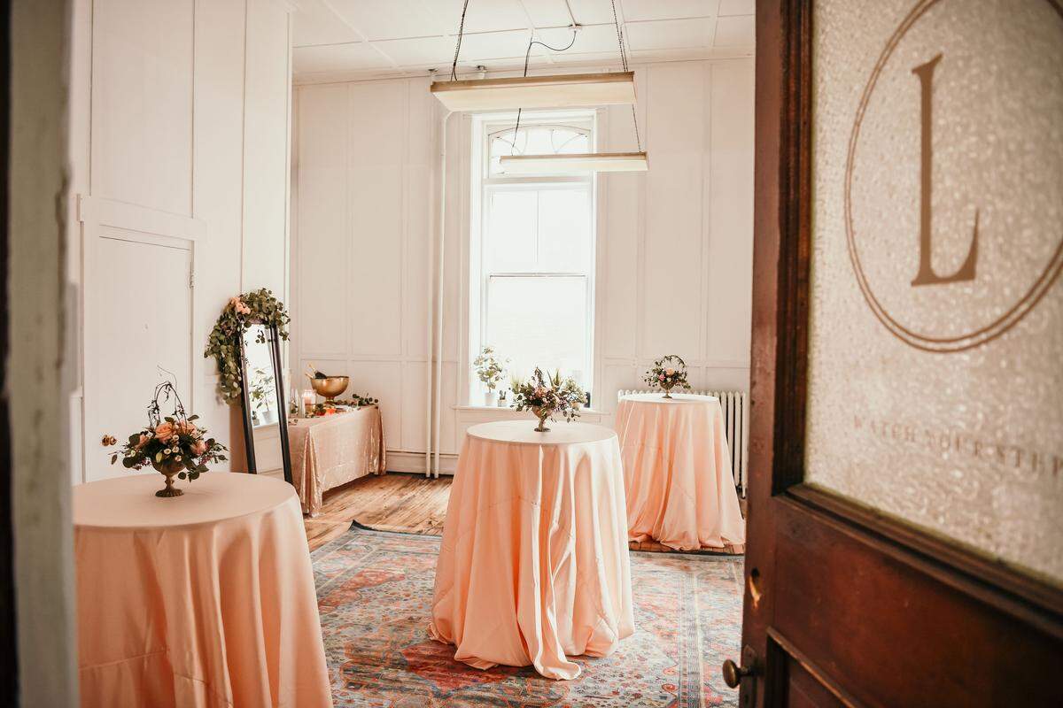Tables adorned with flower bouquets are seen at Lydia Shafer Photography in Bellefonte on Feb. 24, 2019. Shafer hosted a meet-up of the “Local Girl Gang” for women entrepreneurs and creatives.