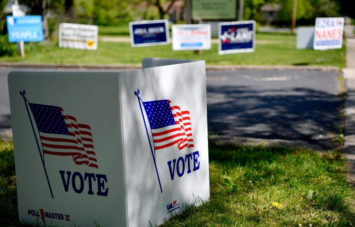 Signs for the Pennsylvania primary election are displayed Tuesday outside the Friends Meeting building.