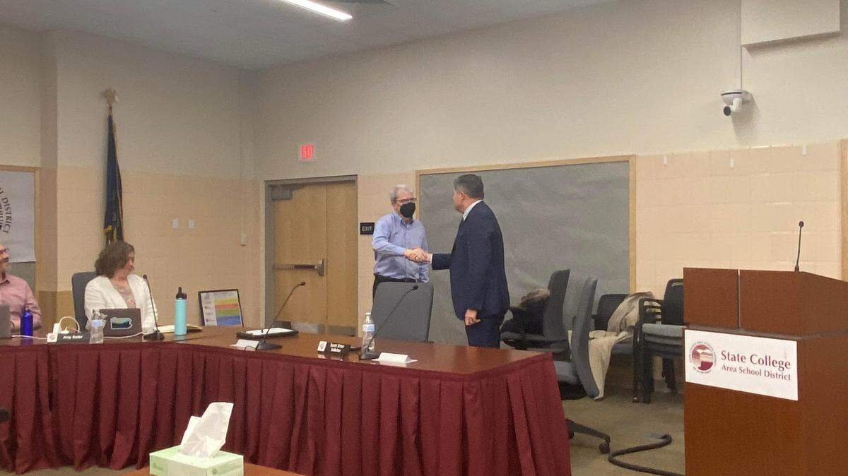 Jim Leous gets sworn in as a State College Area School Board director on Monday night.