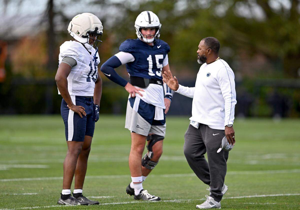 Penn State running back Nick Singleton listens to running backs coach Stan Drayton during practice on Wednesday, Sept. 10, 2025.  