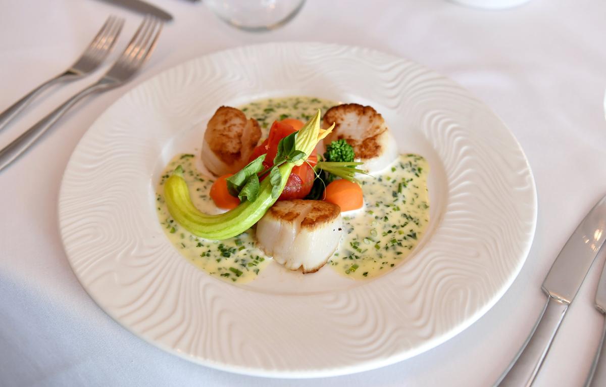 Seared scallops are on the menu at Grace Restaurant at the Carnegie Inn.