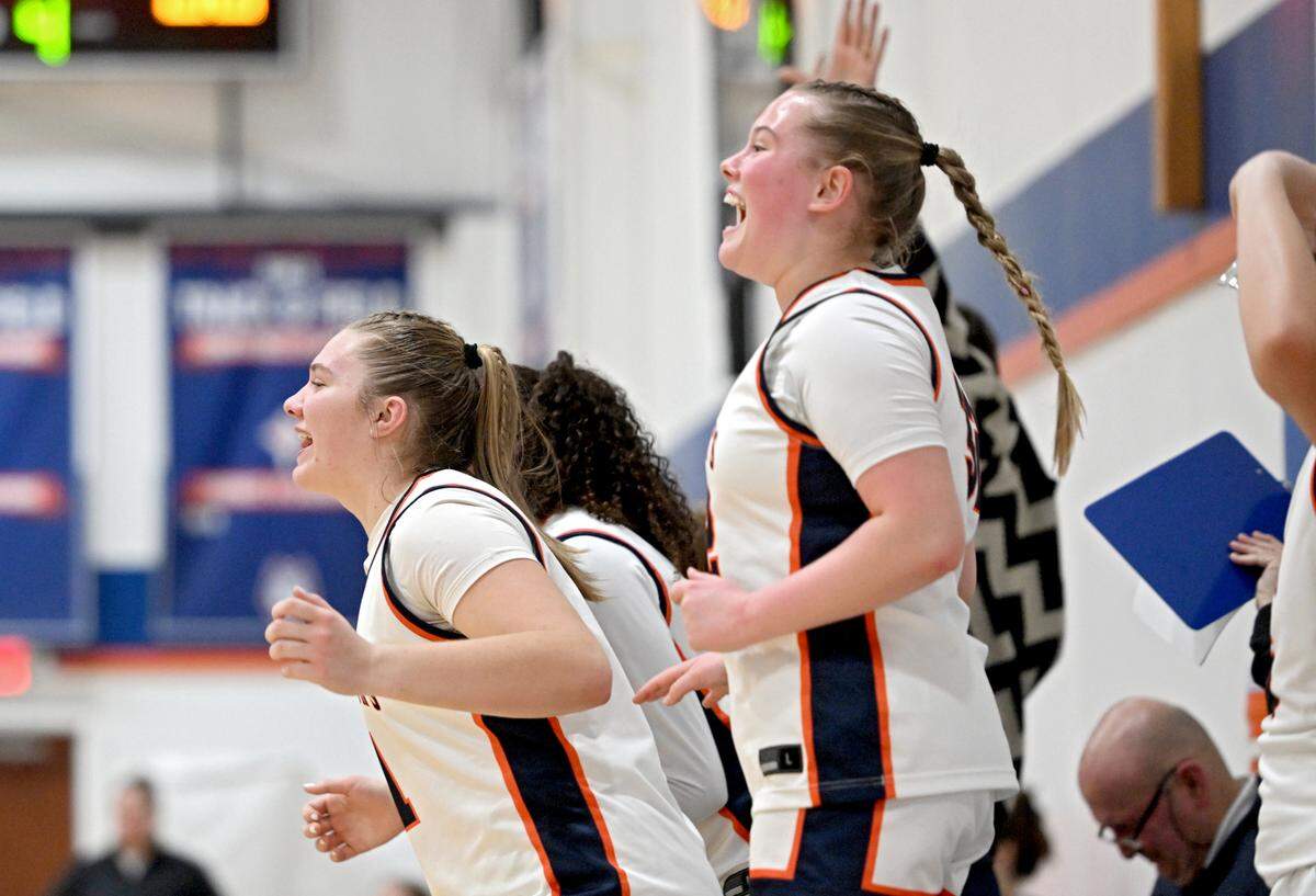 Saint Joseph’s Catholic Academy’s girls basketball players erupt in cheers as a teammate scores a basket during the game against Juniata on Thursday, Jan. 23, 2025. Saint Joseph’s Catholic Academy won, 72-34.