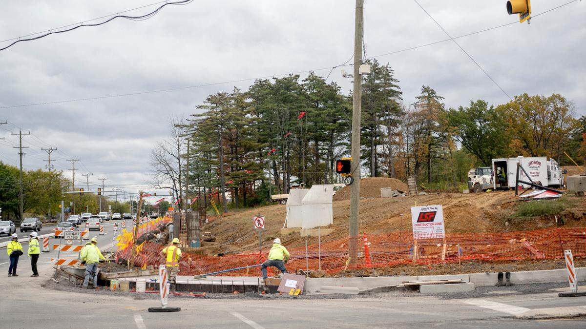 Crews work at Patton Crossing along North Atherton Street on Wednesday, Oct. 18, 2023.
