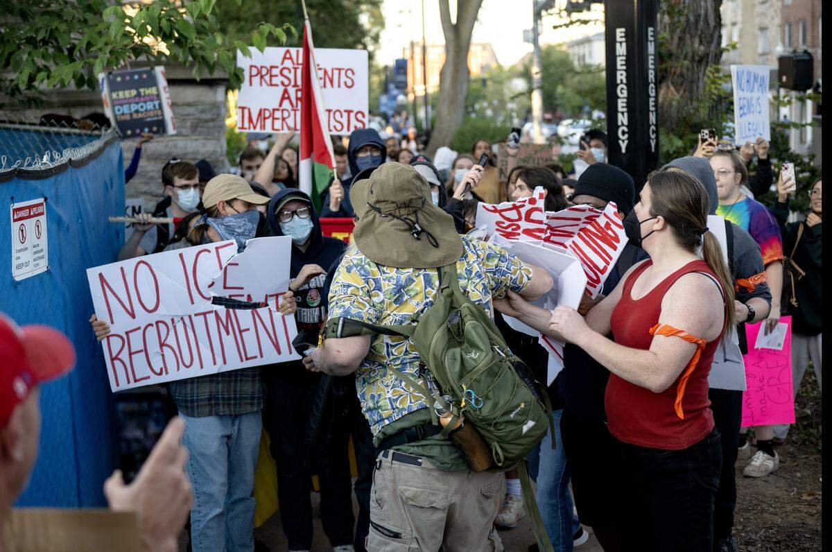 A man clashes with the crowd that had gathered for an anti-ICE protest on Thursday, Sept. 11, 2025.  