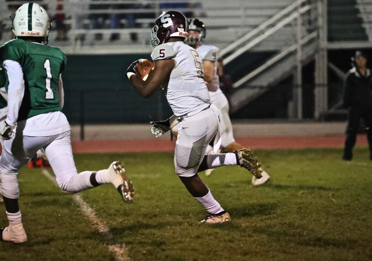 State College Isaiah Edwards runs with the ball against Carlisle on Sept. 13.