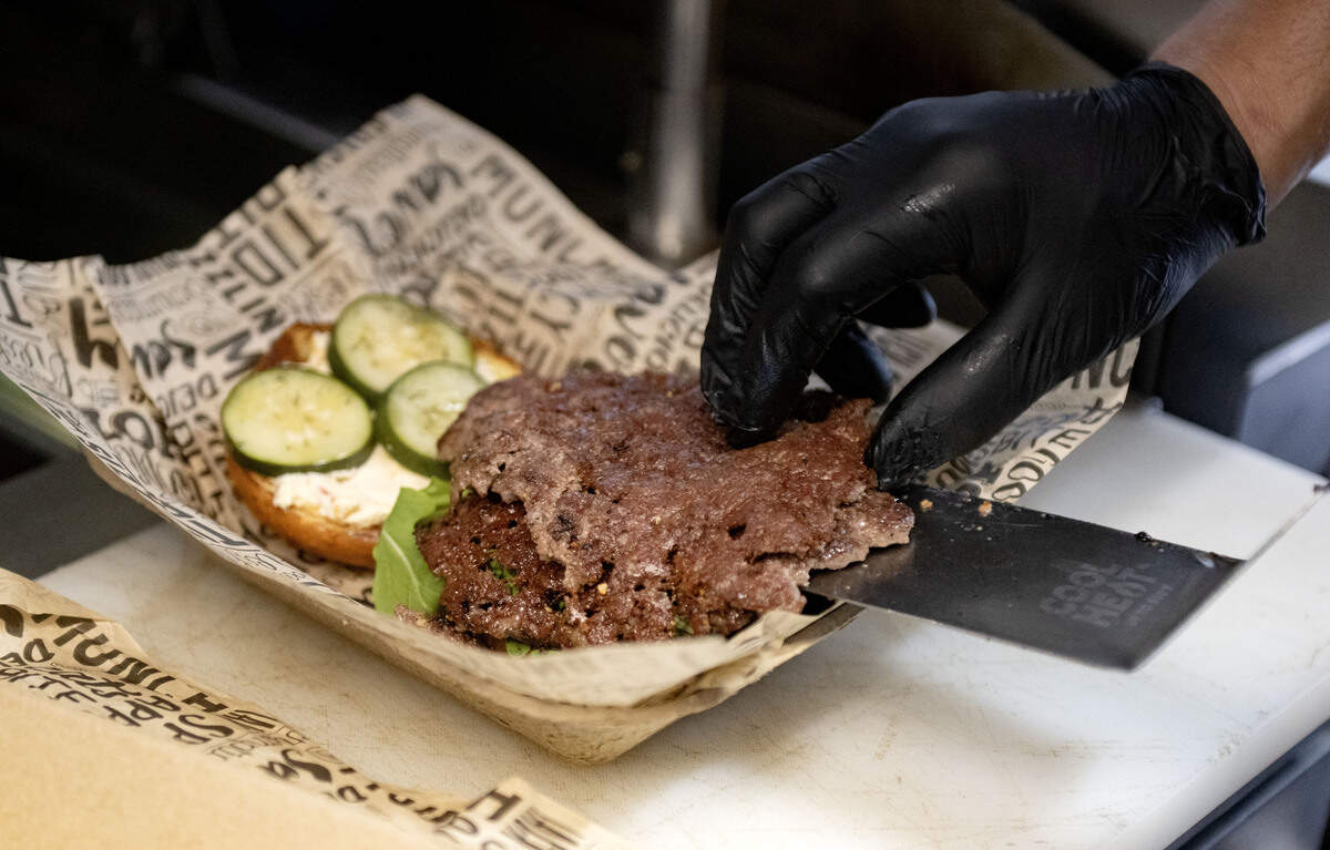 A double down south burger from Dubbs Grub food truck on Thursday, June 18, 2026. The smash burger features two all beef patties, pimento cheese, fried onions, house pickles, arugula and Alabama white BBQ.