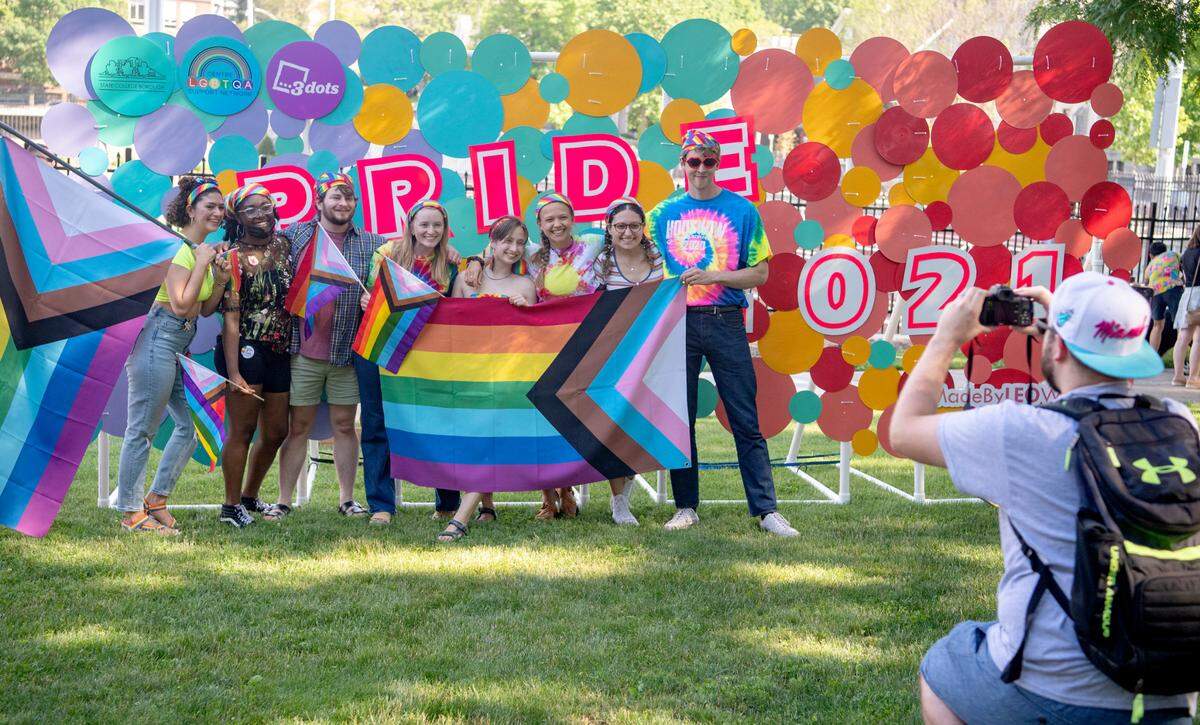 Groups pose for pictures at the State College Pride Ride after-party organized by the Centre LGBTQA Support Network on June 12, 2021.