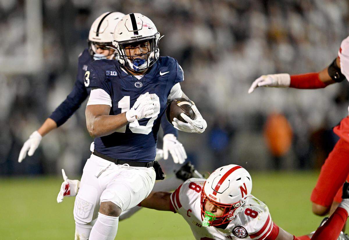 Nebraska defenders can’t stop Penn State running back Kaytron Allen during the game on Saturday, Nov. 22, 2025 at Beaver Stadium.  