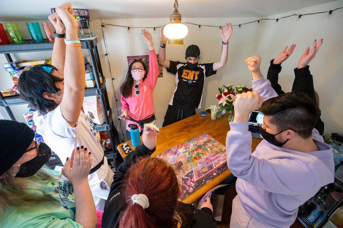Members of the Penn State Thespian Society and Singing Lions complete a puzzle during Thon on Saturday in State College.