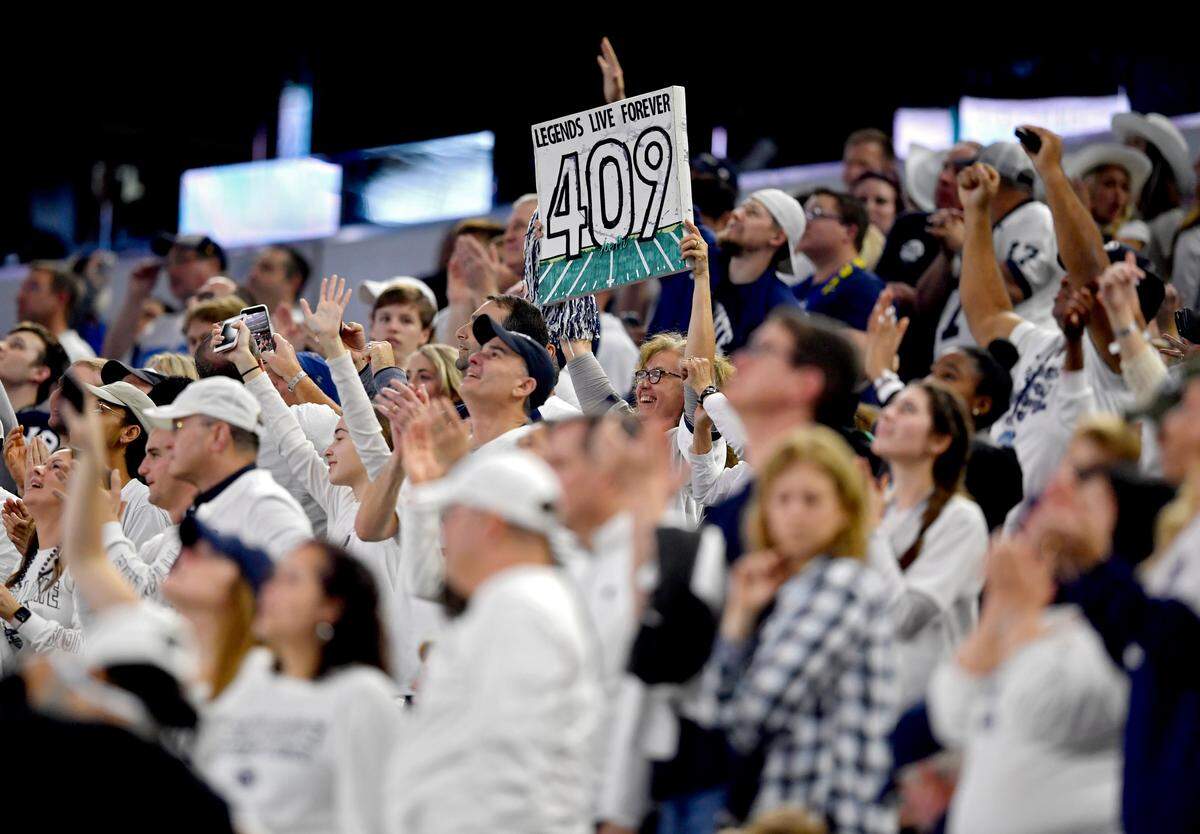 A Penn State fan holds up a sign referencing Joe Paterno during the Cotton Bowl at AT&T Stadium in Arlington, TX on Saturday, Dec. 28, 2019.