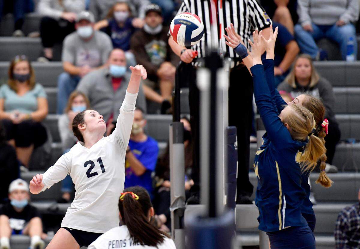 Penns Valley’s Ella Hadley hits the ball as Bald Eagle Area defenders jump to try to block during the match on Wednesday, Oct. 20, 2021.