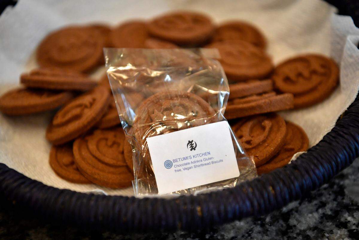 A basket of chocolate adinkra gluten-free, vegan shortbread biscuits made by Fran Osseo-Asare. Betumi’s Kitchen, an online store expected to be operational this spring, offers a mix of the dry ingredients to make the cookie, and cookie stamps inspired by Ghanaian adinkra stamps.