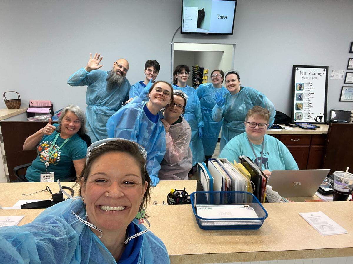 The team at Centre County PAWS is pictured after dozens of dogs were taken in from a single home.